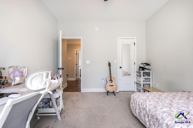carpeted bedroom featuring baseboards