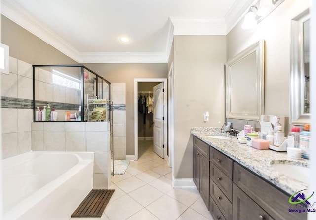 full bathroom featuring a garden tub, a sink, tile patterned floors, and a shower stall