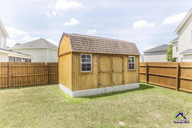 view of shed featuring a fenced backyard