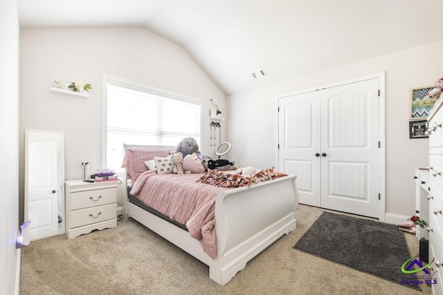bedroom with visible vents, light carpet, lofted ceiling, and a closet