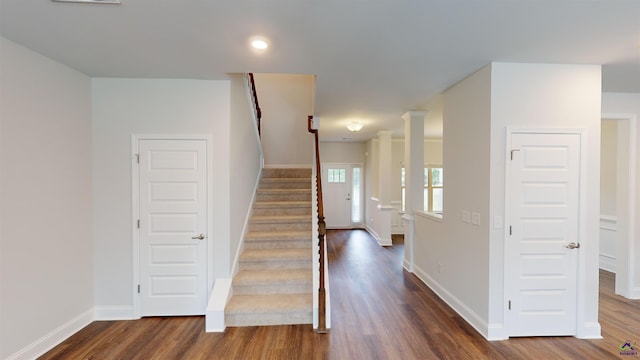 staircase with baseboards, recessed lighting, and wood finished floors