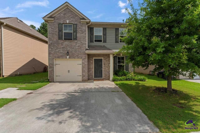 5768 Grande River Rd, Atlanta, GA 30349 - view of front of house with a garage, concrete driveway, a front yard, and brick siding
