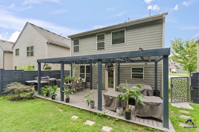 5768 Grande River Rd, Atlanta, GA 30349 - back of house featuring fence, a pergola, a deck, a yard, and outdoor dining space