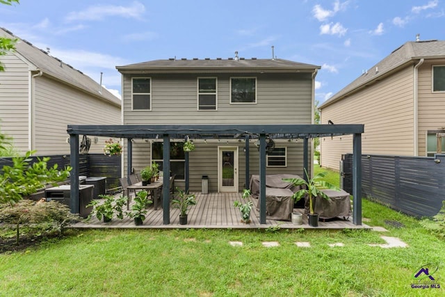 5768 Grande River Rd, Atlanta, GA 30349 - rear view of property with a yard, a pergola, fence, and a wooden deck