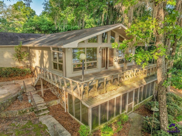 view of outbuilding with a sunroom