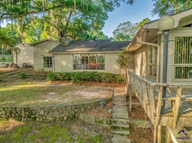 view of property exterior featuring stairs and brick siding
