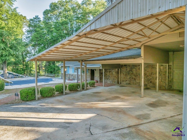 view of vehicle parking with a carport