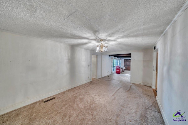 spare room with baseboards, a textured ceiling, and carpet