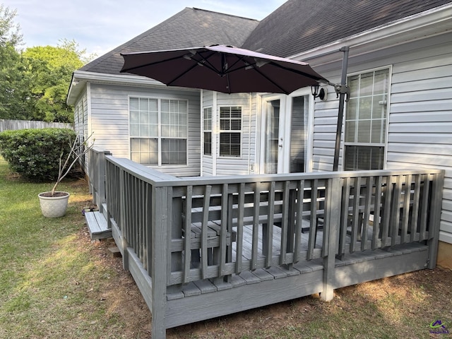 deck with fence and a lawn