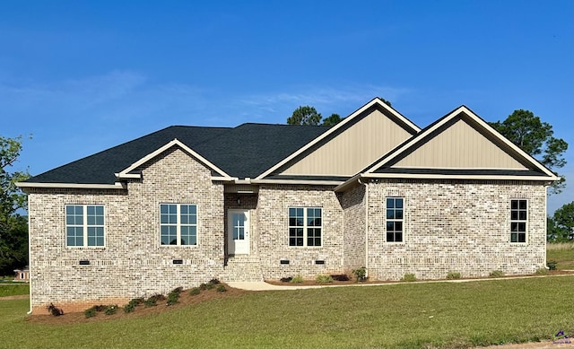 craftsman house with brick siding, a front lawn, and crawl space