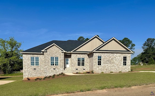 craftsman-style house featuring brick siding, a front lawn, and crawl space