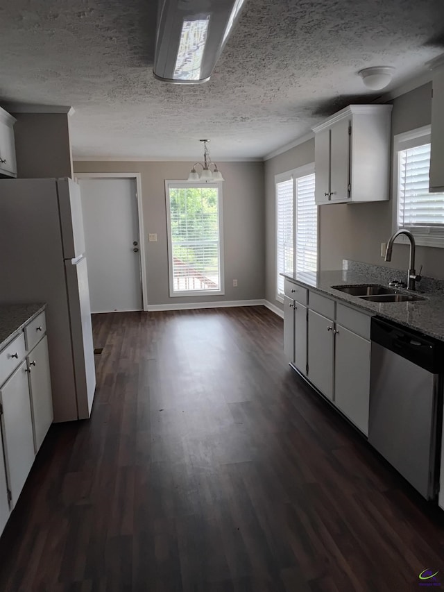 kitchen with stainless steel dishwasher, freestanding refrigerator, dark wood-style flooring, white cabinetry, and a sink