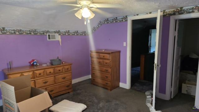 interior space featuring dark colored carpet, a ceiling fan, baseboards, and visible vents