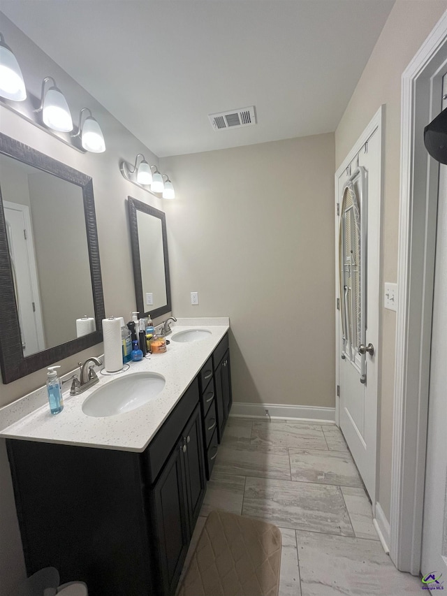 107 Red Tail Cir, Byron, GA 31008 - bathroom with visible vents, a sink, marble finish floor, and baseboards