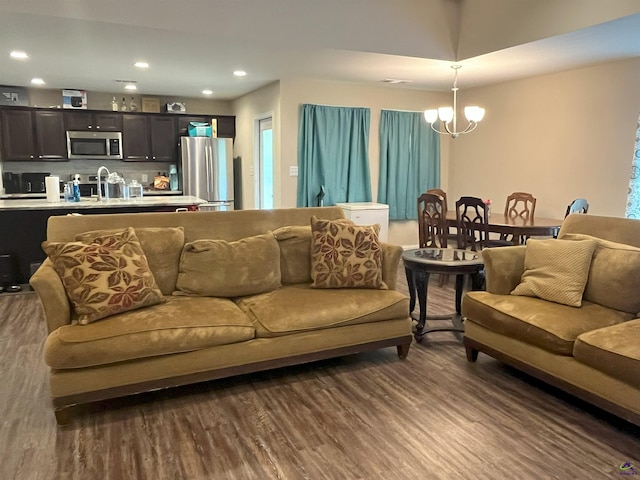 107 Red Tail Cir, Byron, GA 31008 - living room with recessed lighting, a chandelier, and dark wood-type flooring