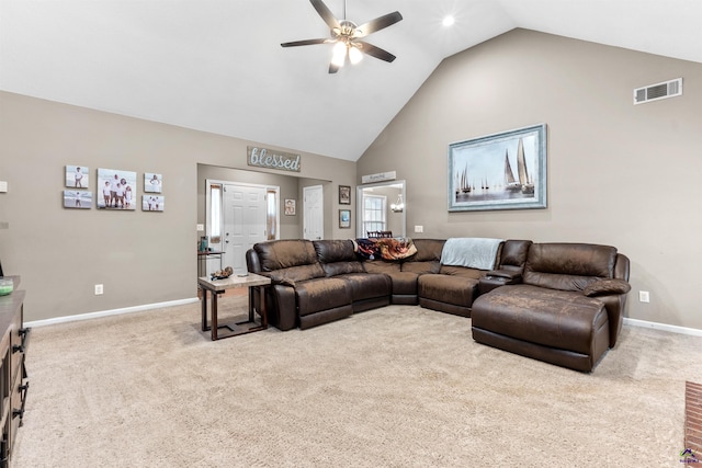 carpeted living room with ceiling fan, visible vents, baseboards, and high vaulted ceiling
