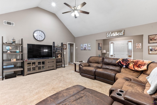 carpeted living room with visible vents, a ceiling fan, and high vaulted ceiling