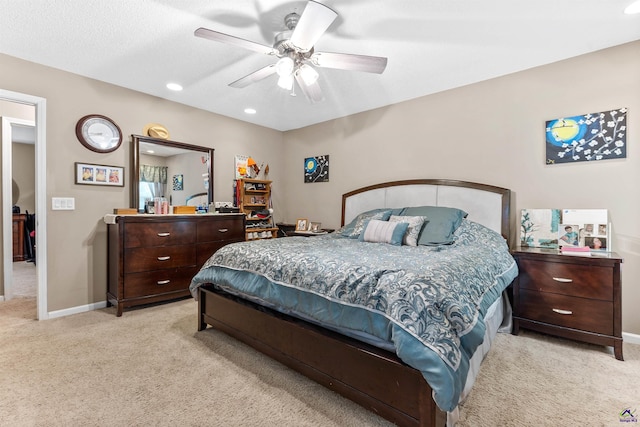 bedroom featuring light colored carpet, recessed lighting, baseboards, and ceiling fan