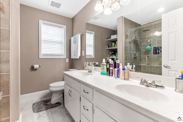 bathroom featuring a sink, a shower stall, toilet, and visible vents