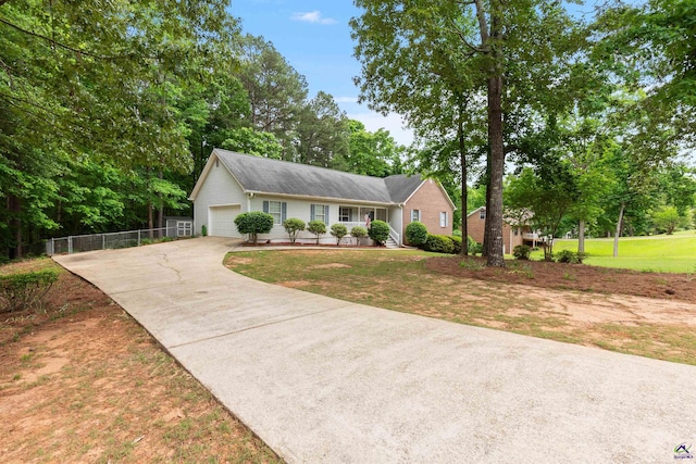 ranch-style home featuring fence, a garage, a porch, a front yard, and driveway