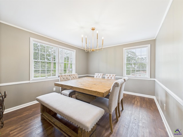 dining room with an inviting chandelier, ornamental molding, baseboards, and dark wood-style floors
