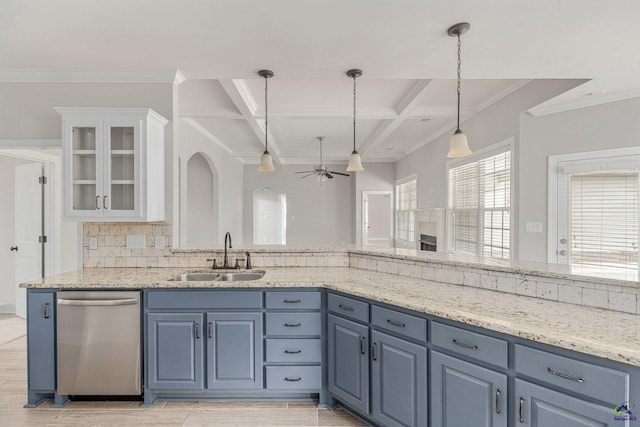 kitchen with a ceiling fan, tasteful backsplash, stainless steel dishwasher, a sink, and coffered ceiling