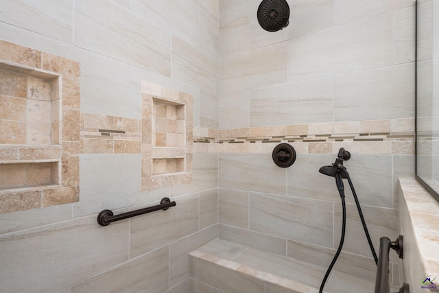 bathroom featuring tiled shower