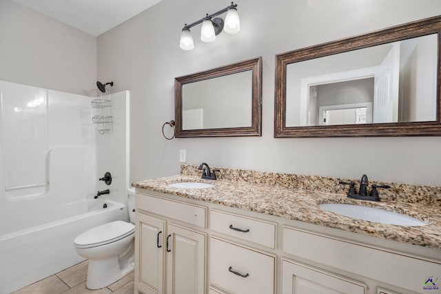full bathroom with a sink, shower / bath combination, toilet, and double vanity
