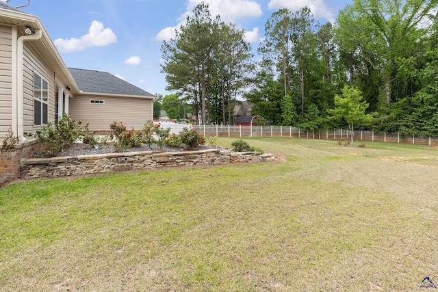 view of yard with a fenced backyard