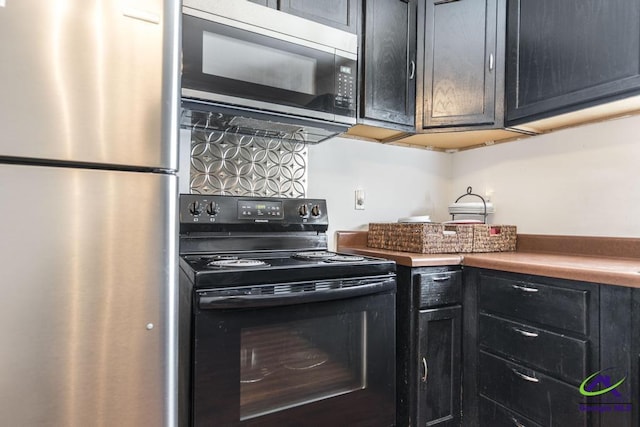 kitchen featuring dark cabinets and stainless steel appliances
