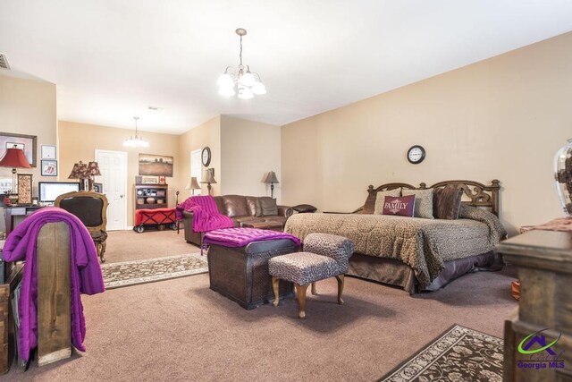 bedroom featuring visible vents, carpet flooring, and a chandelier