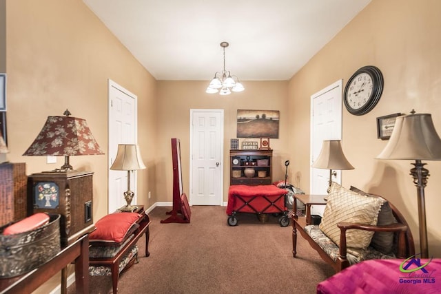 living area with baseboards, carpet, and a chandelier