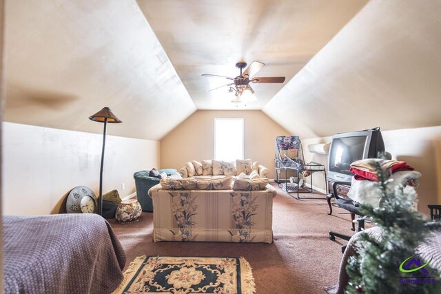 carpeted bedroom featuring baseboards, ceiling fan, and vaulted ceiling