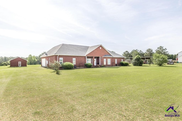 view of front facade featuring brick siding and a front lawn