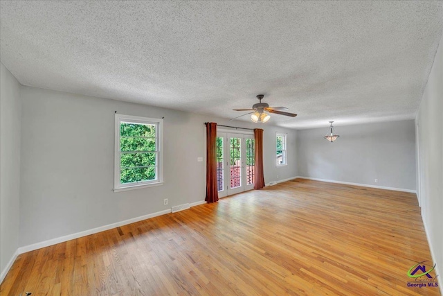 161 Walnut Ridge Dr, Macon, GA 31211 - spare room featuring a ceiling fan, baseboards, a textured ceiling, and light wood-type flooring