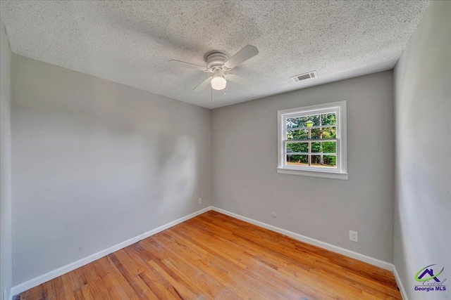 161 Walnut Ridge Dr, Macon, GA 31211 - empty room with ceiling fan, a textured ceiling, visible vents, baseboards, and light wood-style floors