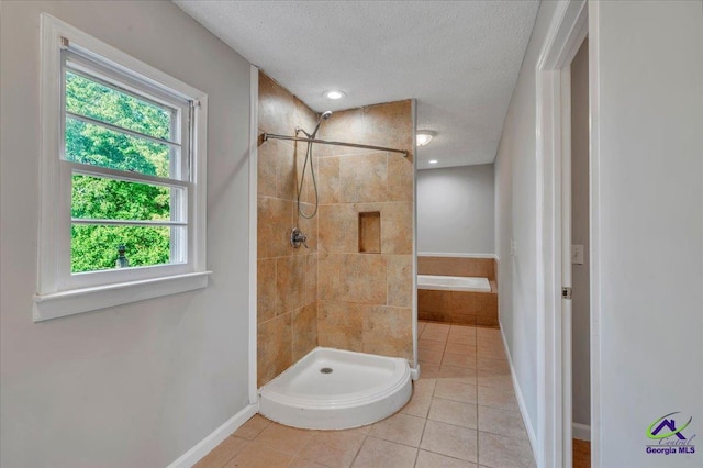 161 Walnut Ridge Dr, Macon, GA 31211 - bathroom with a stall shower, a textured ceiling, and tile patterned floors