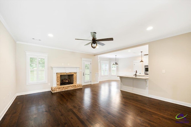 unfurnished living room featuring a fireplace, ceiling fan, dark wood-style flooring, and visible vents