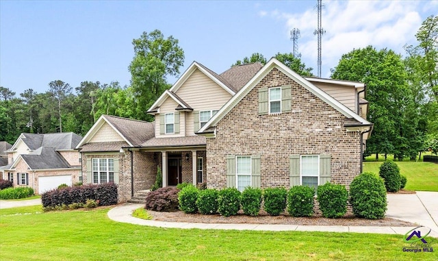 view of front facade with a front lawn and brick siding