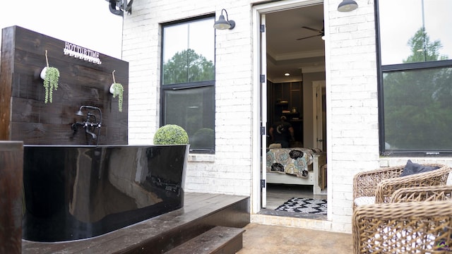 doorway to property with brick siding