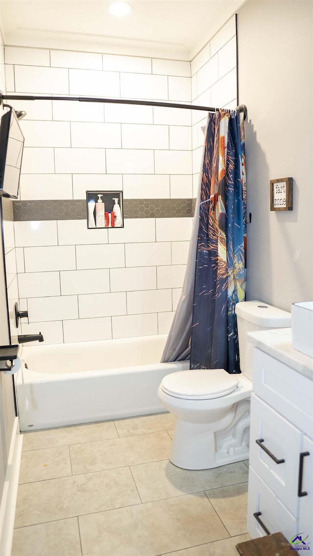 bathroom with toilet, tile patterned flooring, vanity, and shower / bathtub combination with curtain