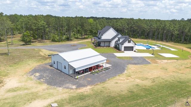 aerial view featuring a view of trees