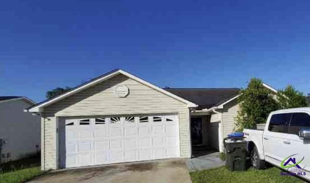 exterior space featuring an attached garage and driveway