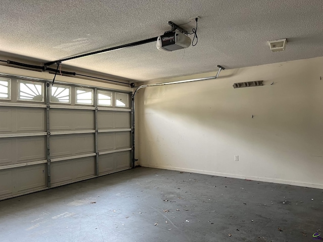 113 Easy St, Dublin, GA 31021 - garage with a garage door opener and baseboards