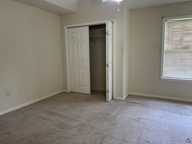 113 Easy St, Dublin, GA 31021 - unfurnished bedroom with carpet, baseboards, multiple windows, and a closet