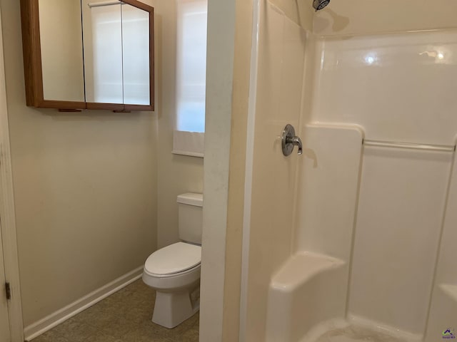 113 Easy St, Dublin, GA 31021 - full bathroom featuring a shower, baseboards, and toilet