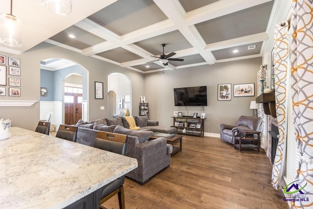 217 Woodlands Blvd, Kathleen, GA 31047 - living area with arched walkways, dark wood finished floors, a ceiling fan, coffered ceiling, and beam ceiling