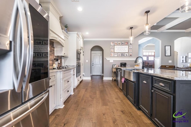 217 Woodlands Blvd, Kathleen, GA 31047 - kitchen featuring appliances with stainless steel finishes, arched walkways, white cabinets, a sink, and recessed lighting