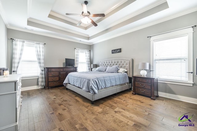 217 Woodlands Blvd, Kathleen, GA 31047 - bedroom with a raised ceiling, hardwood / wood-style floors, multiple windows, and crown molding