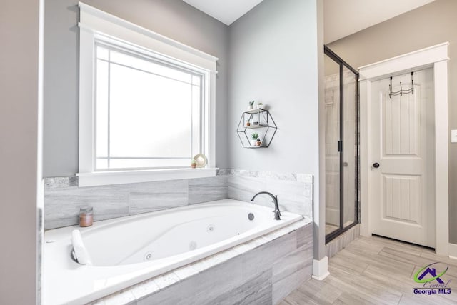217 Woodlands Blvd, Kathleen, GA 31047 - full bathroom featuring a whirlpool tub and a stall shower